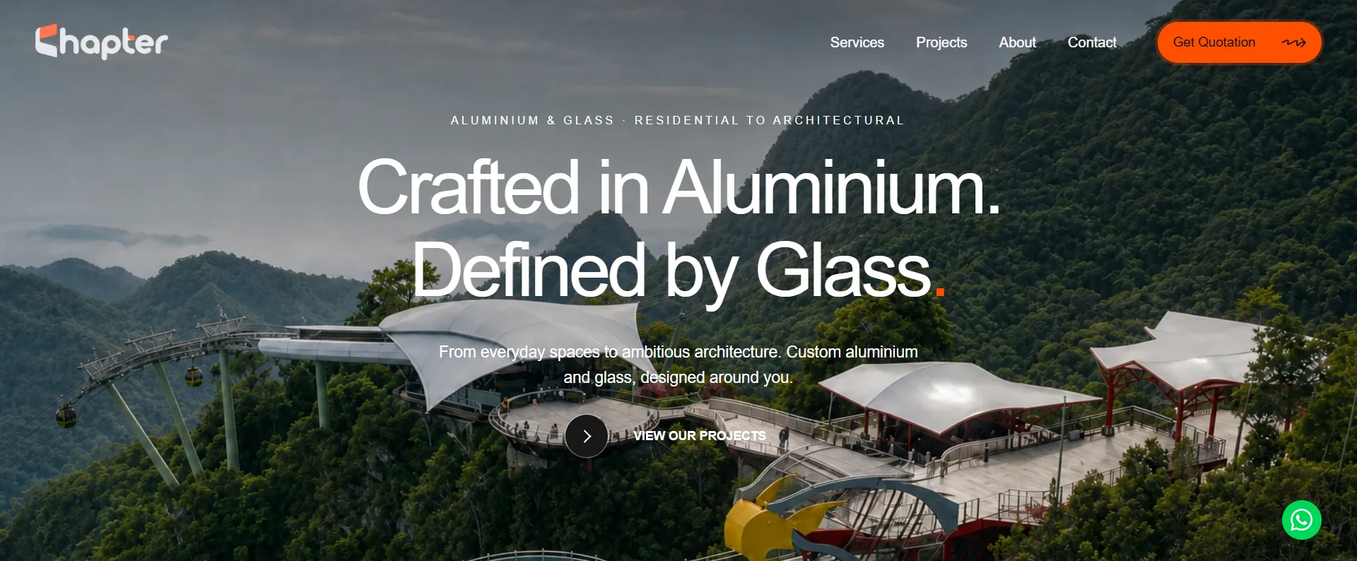 Homepage of the aluminium and glass fabricator site, headlined Crafted in aluminium, defined by glass, over an aerial photo of a glass skywalk